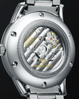 Rear view of the Grand Seiko SBGJ249 watch showing the see-through sapphire exhibition case back, revealing the intricate perlage pattern, striped bridges, and skeletonized components of the automatic Caliber 9S86 Hi-Beat movement.