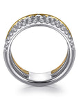 Two-tone ring with diamonds on a white background