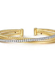 Gold and diamond bracelet on a white background