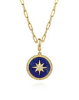 Gold necklace with a blue pendant featuring a star design on a white background