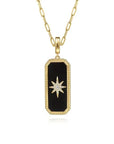 Gold necklace with a black onyx pendant featuring a star design on a white background