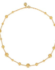 Gold necklace with round beads on a white background