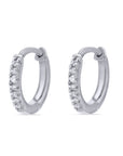 Pair of white gold hoop earrings with clear gemstones on a white background