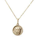 A high-relief 14k yellow gold round bulldog pendant crafted by Skeie's Jewelers, showcasing intricate facial details, a custom bone collar charm, and a matte-finish medallion face with blurred chain on a clean white background.