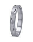 A 3.5mm wedding band by Furrer Jacot, crafted in solid 18k white gold with an architectural, sculpted overlapping braid pattern finished in a fine matte brushed texture. at an upright angled view