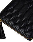 Black quilted leather zip-around case with a gold-tone zipper and a black tassel zipper pull on a white background.