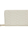 An off-white quilted zip-around wallet with a geometric diamond pattern and a matching tassel zipper pull, shown on a plain white background.