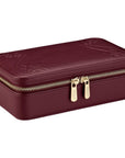 Maroon jewelry box with gold zipper on a white background