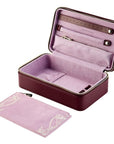 Pink jewelry case with a matching pouch on a white background