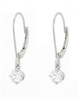 Pair of white earrings with diamond dangles on a white background