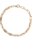 Gold chain bracelet with a clasp on a white background top view