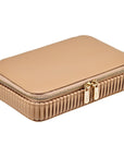 Beige jewelry case closed with gold zipper on a white background