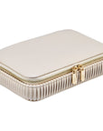 White jewelry case with gold zipper on a white background