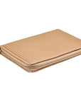Beige ribbed zippered pouch on a white background