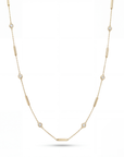 Gold necklace with small diamonds on a white background