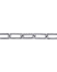 A close-up of a silver-toned chain link bracelet featuring a central textured beaded connector link, shown against a plain white background.