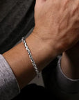 Silver bracelet on a wrist