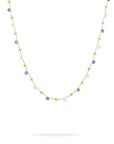 Necklace with small blue beads on a white background
