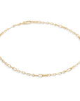 A delicate yellow gold chain anklet with elongated oval links and a lobster clasp, displayed on a clean white background.