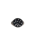 Black ring with embedded diamonds on a white background