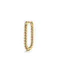 Gold earring with beaded design on a white background