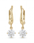 Gold hoop earrings with round clear gemstones on a white background