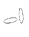 Two diamond hoop earrings on a white background