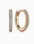 Rose gold hoop earrings with diamond accents on a white background