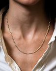 Gold Diamond necklace close up on modeled neck