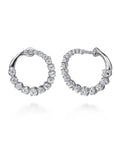 A pair of Gabriel & Co. 14k white gold bypass hoop earrings (Reference EG15558W45JJ) showcasing a fluid, overlapping ribbon design set with a shimmering rows of small round brilliant diamonds, displayed against a clean white background