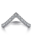 A Gabriel & Co. V-curved anniversary band, showcasing a sharp chevron line of round brilliant-cut diamonds set in high-polish 14k white gold, sculpted to fit around low-profile engagement ring center stones.