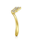 Gold ring with diamond accents on a white background side profile
