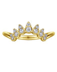 Gold ring with diamond accents on a white background