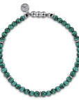 Green 4mm beaded bracelet with silver clasp on a white background