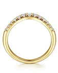 Gold ring with diamonds on a white background upright view