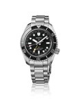 A Seiko Prospex 1968 Heritage Diver's GMT HBC002J1 automatic watch, showcasing its 42mm stainless steel case, a glossy black ceramic elapsed-time bezel, a matching oceanic black dial with large luminous markers, a gold-tone GMT hand, and a steel link bracelet.