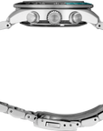 A Seiko stainless steel chronograph watch with a green dial and a black bezel featuring a green 24-hour marker ring, shown on a clean white background - side view