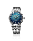 A Seiko Automatic watch with a silver stainless steel link bracelet and a textured blue dial, shown on a clean white background with a subtle reflection.