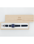 Seiko watch in a wooden box on a white background