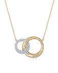 A front view of the Kwiat Cobblestone Interlocking Pendant Necklace (Style N-9837-0-DIA-18TT) featuring two intertwined circular rings—one in high-polish 18k yellow gold with burnished accent diamonds and one in 18k white gold covered in shimmering pavé diamonds—suspended from a fine gold chain on a crisp white background.