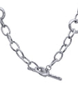 Silver chain necklace with a clasp on a white background