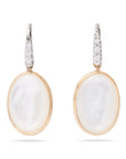 Pair of earrings with white mother of pearl stones and gold accents on a white background