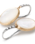 Pair of earrings with white mother of pearl stones and gold and white gold hooks on a white background