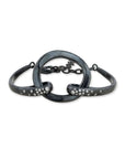 An artisanal Lika Behar "Orion" chain link bracelet crafted in textured, dark oxidized sterling silver, accented with sparkling white diamond stations totaling 0.30 carats.