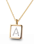 A gold initial necklace featuring a square pendant with the letter 'A' spelled out in diamonds, displayed on a clean white background.