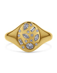 Gold ring with mixed shape diamonds on a white background