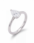 white gold ring with a pear-shaped lab diamond on a white background