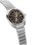 Silver Seiko watch with a black face on a white background angled view