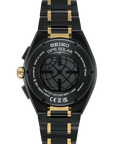 back of Black and gold Seiko GPS Solar watch on a white background