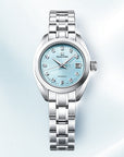 Silver watch with a light blue face on a soft blue background